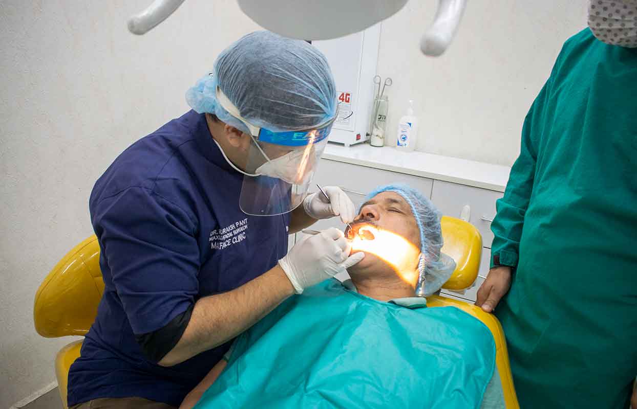 Dr. Rudraksh Treating the patient-Best Dentist in Haldwani